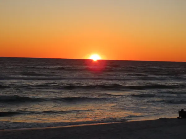 Sunset over the Gulf from Pineapple Willy's beach