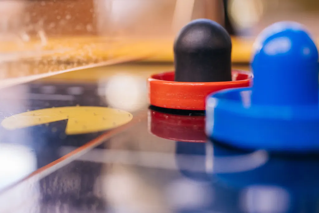 Close-up of air hockey mallets