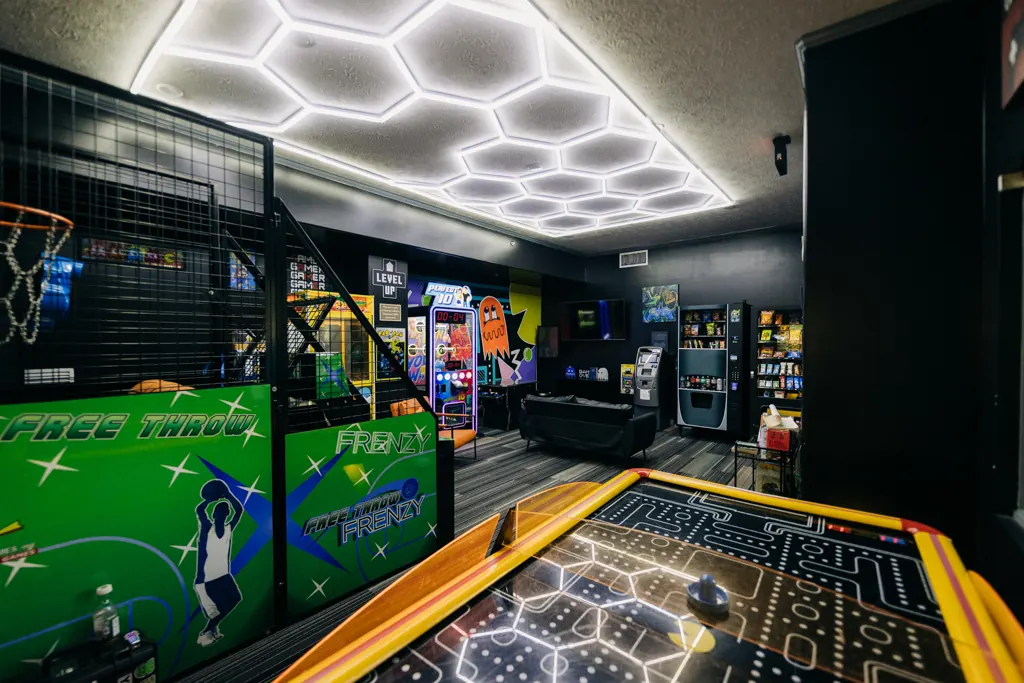 Arcade basketball and air hockey in the game room