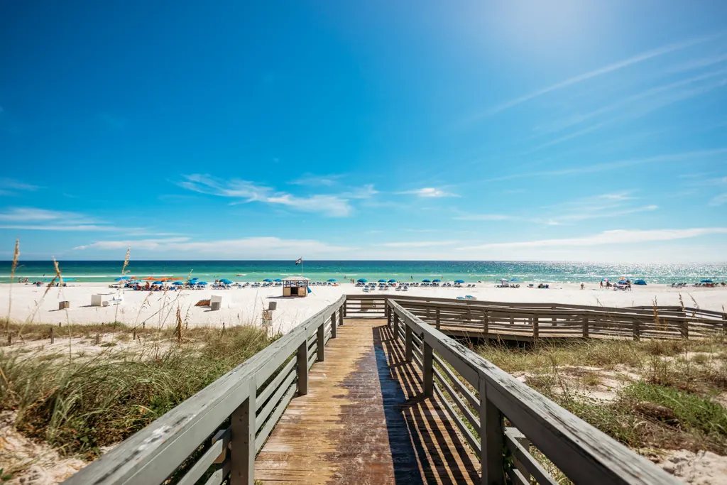 Wooden boardwalk over the dunes leading to the beach and the Gulf at Gulf Crest Condominiums