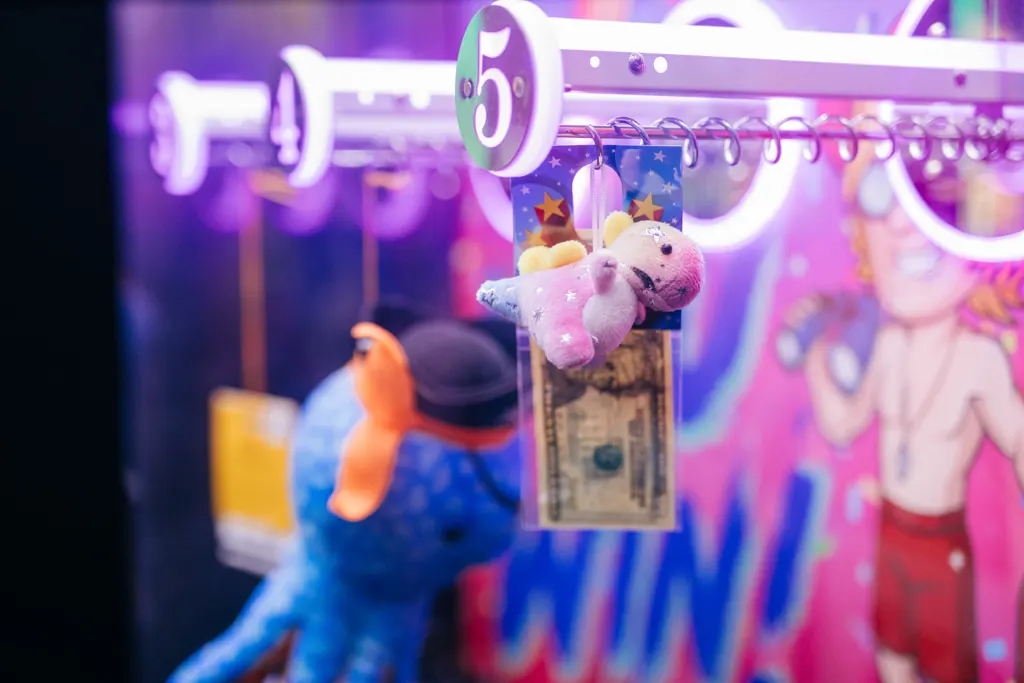 Claw machine prizes in neon light