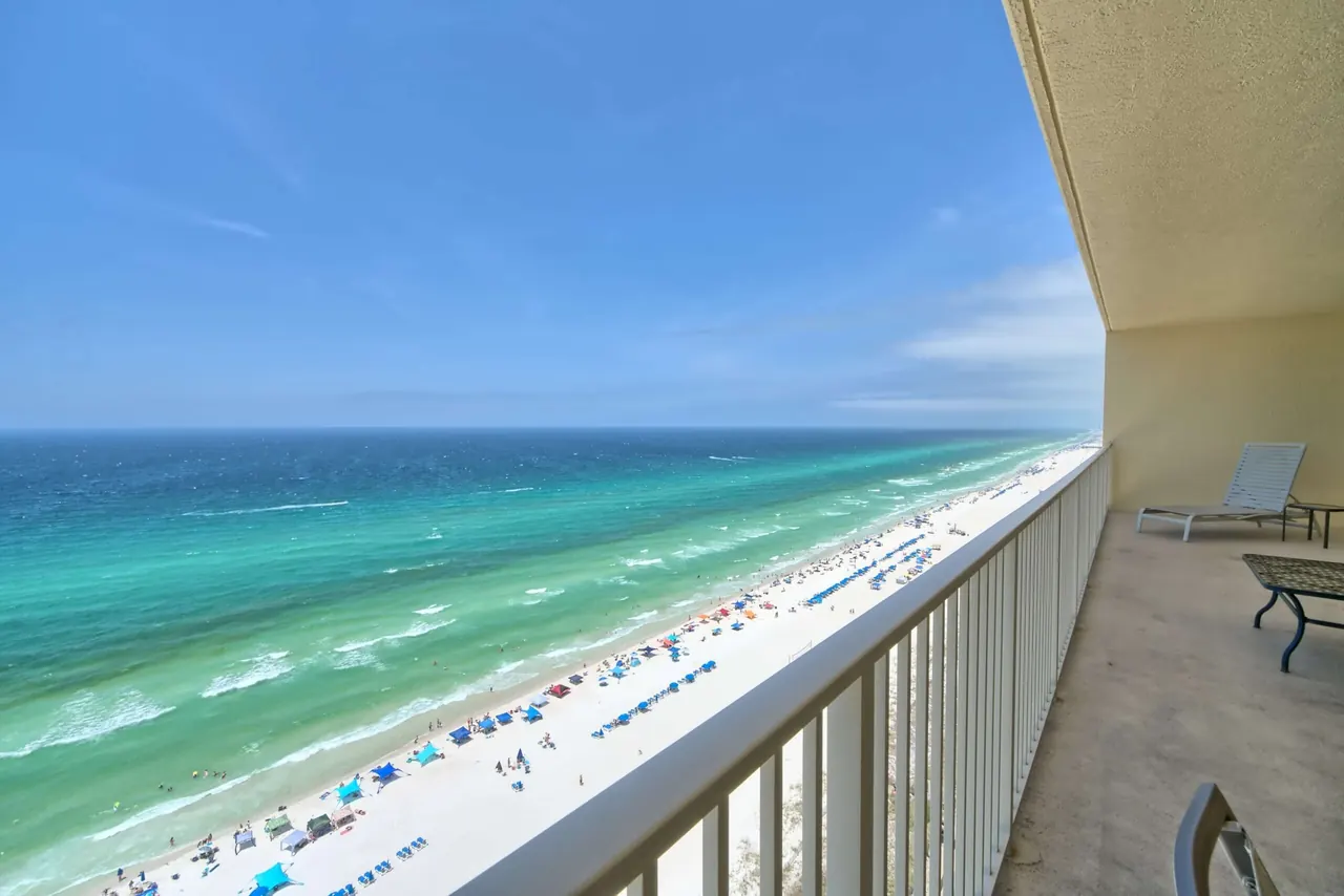 Emerald Gulf of Mexico and white-sand beach seen from a high-floor balcony at Gulf Crest Condominiums in Panama City Beach