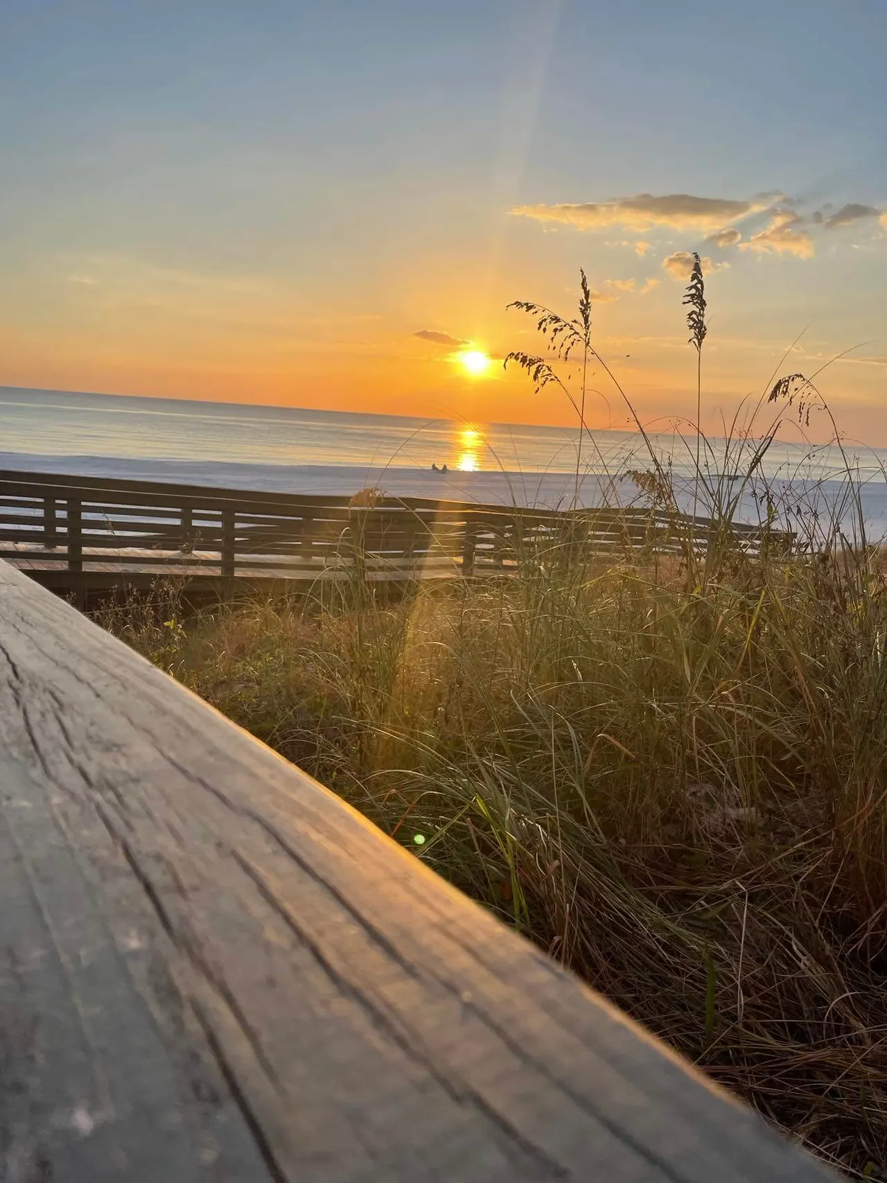 Sunset over the sea oats and dunes from the Gulf Crest boardwalk
