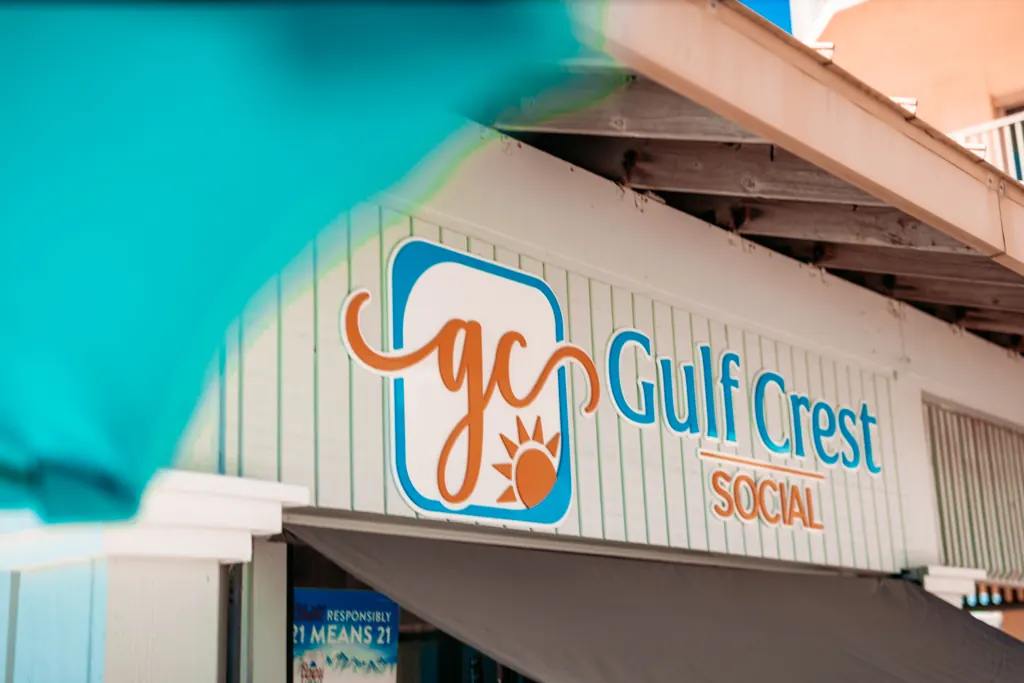 Gulf Crest Social bar signage on the pool deck