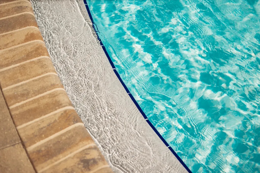 Sparkling pool water at the tiled pool edge